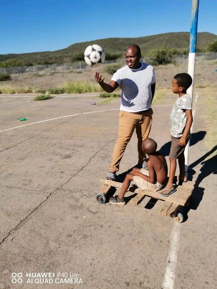 Our Chairperson sharing a joyful moment with children in the community